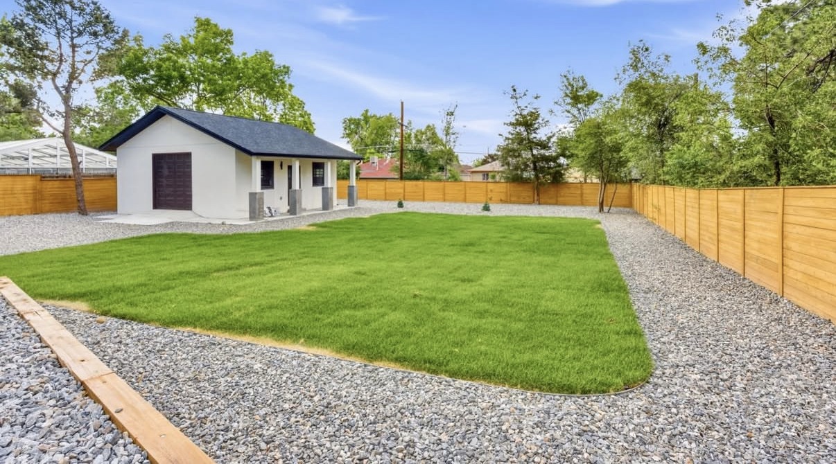 Backyard with new sod, gravel borders and a detached studio