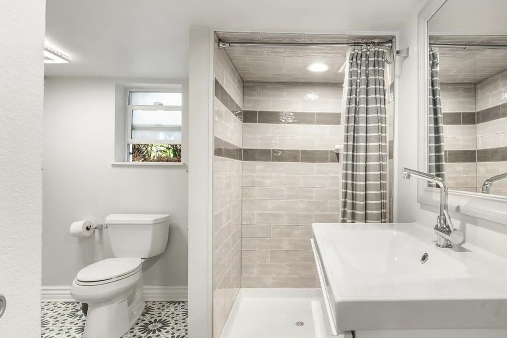 Basement bathroom with a tiled walk-in shower
