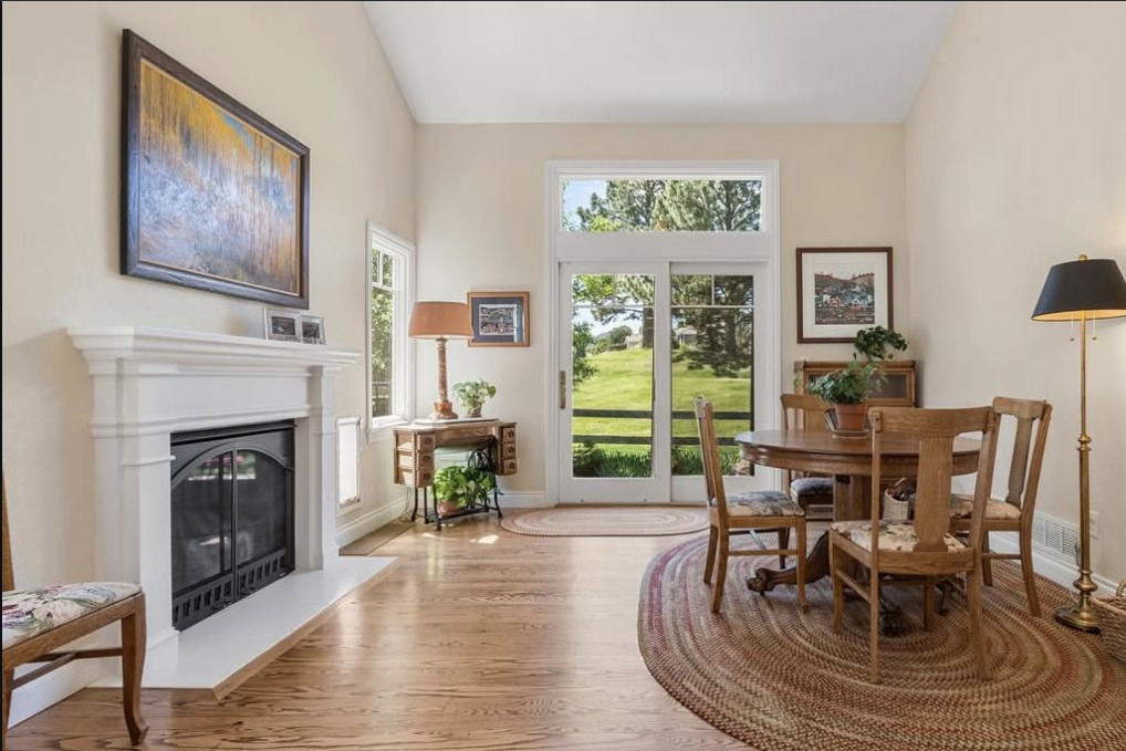 Family room with a fireplace and doors to the backyard
