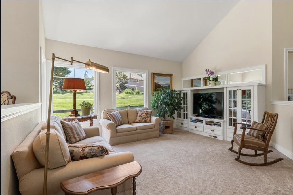 Vaulted living room with built-in shelving