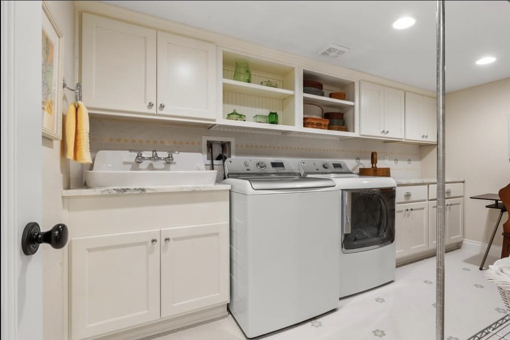 Laundry room with a farmhouse sink and sewing area