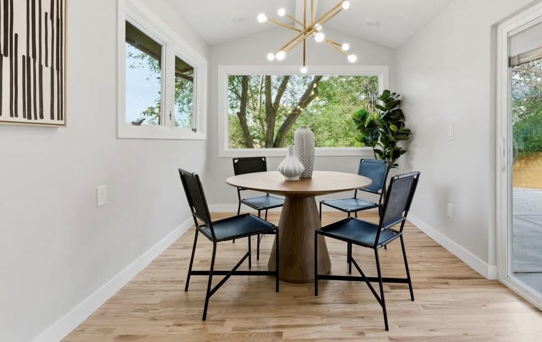 Breakfast nook with a vaulted ceiling and garden views