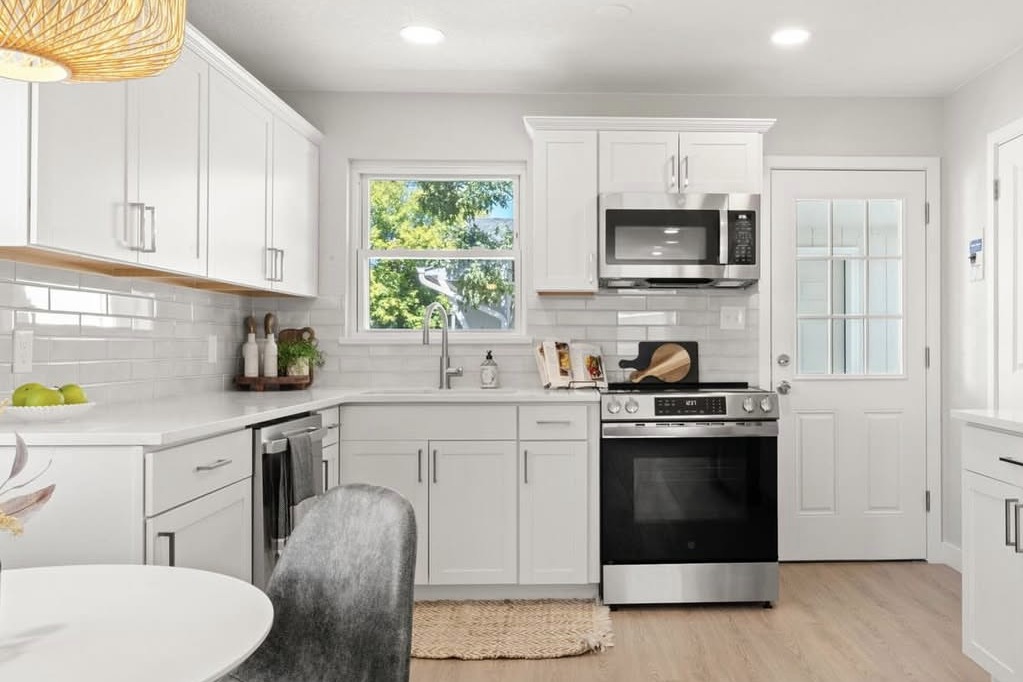 White kitchen with subway tile and open shelving