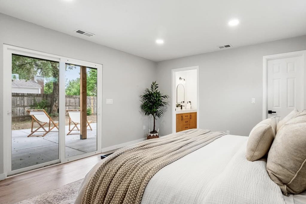 Primary bedroom with a sliding door to the covered patio